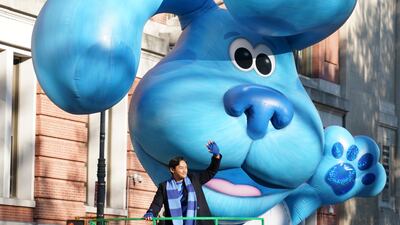 Actor Josh Dela Cruz on the Blues Big City Adventure float waves. EPA