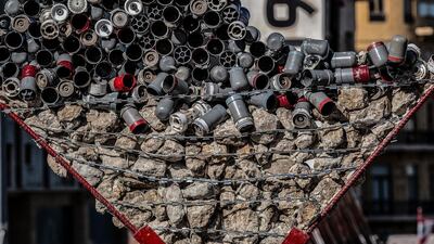 A memorial of a broken heart made of gas tear bombs and stones which were used during clashes between protesters and riot police during the past weeks, has been placed next to the fist symbol of the revolution in the Martyrs' Square in Beirut, Lebanon. EPA