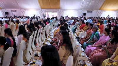 People attend the foundation stone laying ceremony.