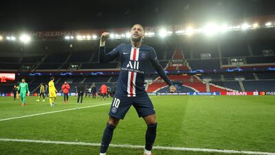 Neymar celebrates in front of an empty Parc des Princes stadium after Paris Saint-Germain had knocked Borrussia Dortmund out of the Champions League on Wednesday, March 11. AFP