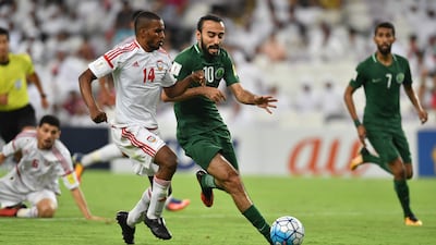 UAE defender Mahmoud Khamis, left, vies for the ball with Saudi Arabia forward Mohammed Al Sahlawi at Hazza bin Zayed Stadium on Tuesday. Giuseppe Cacace / AFP