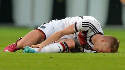 Germany's Marco Reus lies on the pitch injured against Armenia. AP Photo