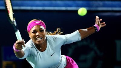 Serena Williams returns the ball to Serbia's Jelena Jankovic during their quater final match in the Dubai Duty Free Tennis Championship on February 20, 2014. AFP PHOTO / MARWAN NAAMANI