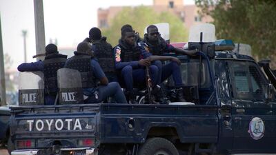 Police officers stand gaurd outside the courthouse, where former Sudanese president Omar al-Bashir and more than 20 others are tried for their role in the 1989 military takeover of the government, Khartoum, Sudan. EPA