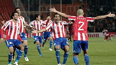 Paraguay's players celebrate after Veron's match-winning spot kick in the Copa America semi-final.