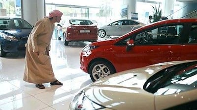 A Ford Fiesta comes under scrutiny in Premier Motors' Abu Dhabi showroom. The American car manufacturer is forecasting sales in the UAE to top 13,500 this year. Philip Cheung / The National