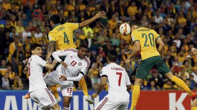 Australia’s Trent Sainsbury heads the ball to score the first goal against UAE in the second semi-final in Newcastle. Jason Reed / Reuters
