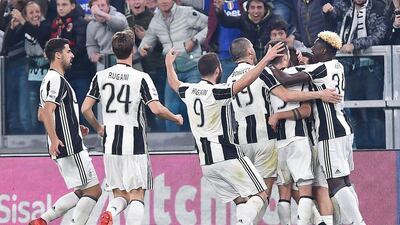 Juventus players celebrate a last-gasp win against AC Milan in their Serie A encounter at Juventus Stadium in Torino on March 10, 2017. Alessandro di Marco / EPA