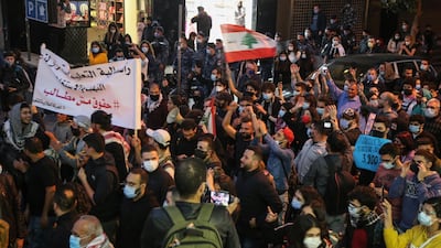 Students from different universities carry placards, wave Lebanese flags during a demonstration under the slogan of 'A Day of Student Rage' in Al-Hamra, Beirut. EPA
