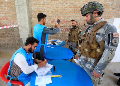 Afghan policemen arrive to cast their votes in the presidential election in Jalalabad, Afghanistan. Reuters