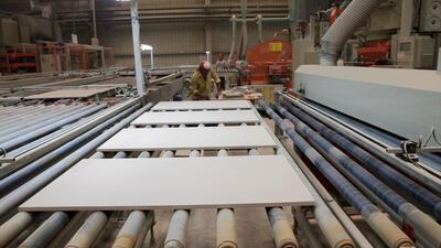 Workers during the press process at the RAK Ceramics Factory. Jaime Puebla / The National