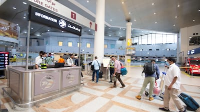 Passengers arrive at Kuwait International Airport. EPA