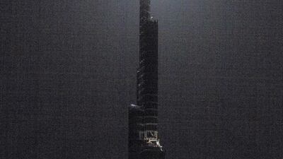 A full moon rises above the Burj Khalifa in the Emaar Square area of Dubai on August 7, 2017. Christopher Pike / The National.