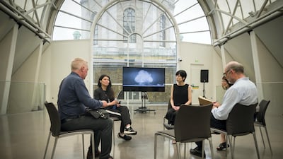 Artists Es Devlin and Machiko Weston are interviewed by journalists while a screen displays a part of their commissioned video installation "I Saw The World End", at the Imperial War Museum in London, England. Getty Images