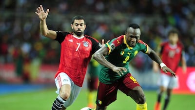 Ahmed Hassan Kouka, left, of Cameroon is challenged by Ahmed Fathi of Egypt. Samuel Shivambu / EPA