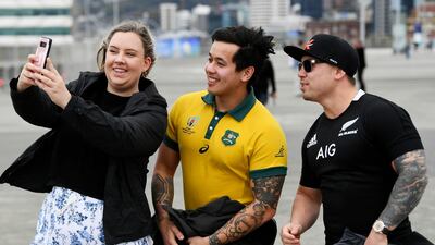 Fans take a selfie as they arrive at the stadium ahead of during the Bledisloe Cup rugby game between the All Blacks and the Wallabies in Wellington, New Zealand. AP Photo