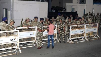 Indian security personnel stand guard outside the airport as the family of late Indian actress Sridevi Kapoor arrive with her mortal remains in Mumbai, India. Divyakant Solanki / EPA