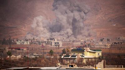Smoke rises during clashes between Peshmerga forces and ISIL militants in the town of Bashiqa, east of Mosul on November 7, 2016. REUTERS/Azad Lashkari