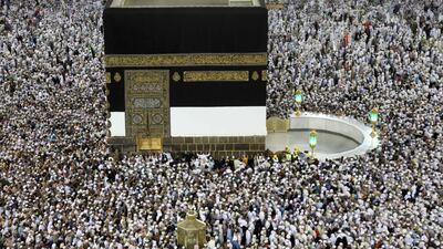 Muslim worshippers perform the evening prayers at the Kaaba, Islam's holiest shrine, at the Grand Mosque in Saudi Arabia's holy city of Mecca. Bandar Al Bandani / AFP Photo