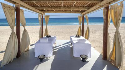Couples' treatments on the beach at Anantara Al Yamm Villa Resort.