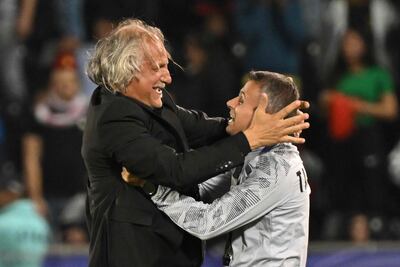 Manager Petar Segrt, left, celebrates after the win against Lebanon that sealed Tajikistan's place in the Asian Cup last 16. AFP