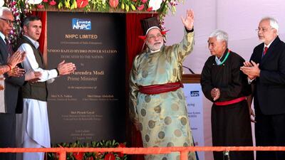 India’s prime minister, Narendra Modi, second right, and the chief minister of Jammu and Kashmir, Omar Abdullah, second left, launch a hydropower project in Leh on August 12, 2014. Press Information Bureau / AFP