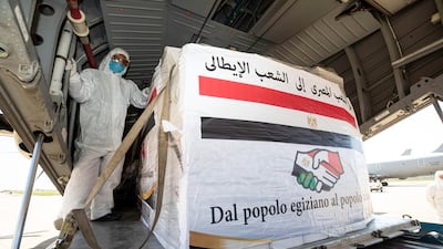 Airport staff unload medical aid sent to Italy from Egypt near Rome. EPA