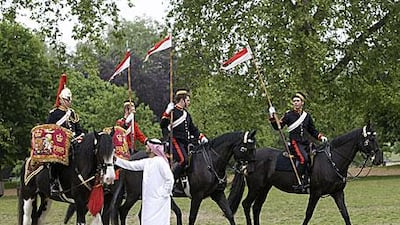 Talal al Hashemi, a member of a delegation from Abu Dhabi Authority for Culture and Heritage, meets Household Cavalry troops in London's Hyde Park.