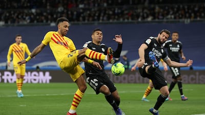 Pierre-Emerick Aubameyang battles for possession with Casemiro of Real Madrid. Getty Images