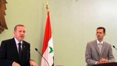 The Syrian president Bashar Assad, right, listens in as the Turkish prime minister Recep Tayyip Erdogan speaks during their press conference in the Syrian capital on Monday.