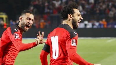Egypt's forward Mohamed Salah and midfielder Amr el-Solia celebrate the goal against Senegal. AFP
