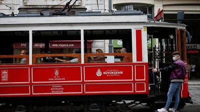 People use the tram on Istiklal street, the main shopping street in Istanbul, Turkey. AP Photo