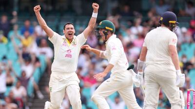 Australia's Scott Boland (L) celebrates with team mate Marnus Labuschagne (C) after they dismissed EnglandÕs Jonny Bairstow (R) on day five of the fourth Ashes cricket test between Australia and England at the Sydney Cricket Ground (SCG) on January 9, 2022. (Photo by DAVID GRAY / AFP)