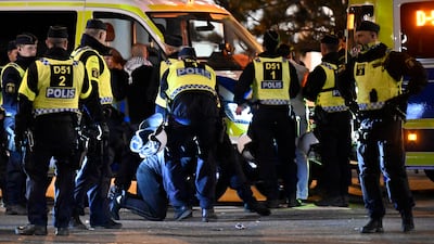 Protesters are detained by Swedish police outside the Malmo Arena, where a pro-Palestine rally against the participation of Israel in the 68th Eurovision Song Contest took place. EPA