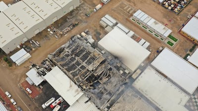 Storage facilities near the Iraqi city of Basra damaged by attacks. Iraq is the Opec producer hit hardest by the regional conflict. Reuters