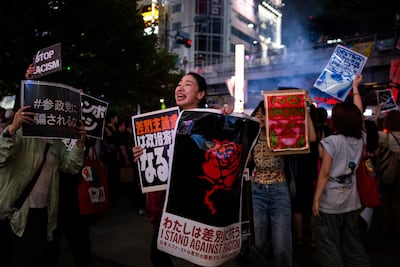 Demonstrators take part in a 'protest rave' against racism and the nationalist Sanseito party ahead of the upper house election in the Shinjuku district of Tokyo in July. AP