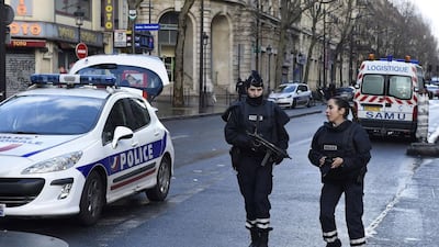 Armed French police are seen in the north of Paris after police shot a man dead as he was trying to enter a police station (AFP PHOTO / LIONEL BONAVENTURE)