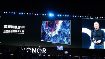 George Zhao, president of Honor, a branch of Huawei, unveils its Smart Screen equipped with Harmony OS at the HDC in Dongguan, Guangdong. AFP