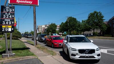 Motorists line up for fuel at one of the few remaining gas stations that still has fuel in Arlington, Virgina, on May 13, 2021. AFP