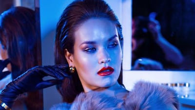 ANIMAL INSTINCT: Coat, Dh12,440, Simone Rocha. Earrings, Dh12,944; cuff, Dh17,486, both from Christoff. Leather gloves, stylist’s own.