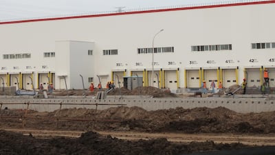 Workers are seen at the construction site of US electric car maker Tesla's Gigafactory in Shanghai. Moody's says Chinese firms will see the strongest revenue growth among construction companies globally. Reuters.