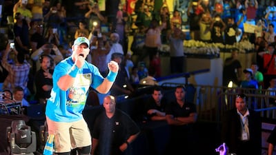 John Cena, cheers the fans before the fight during a Intercontinental Championship match the main event of WWE Live at Zayed Sports City yesterday in Abu Dhabi. Ravindranath / The National