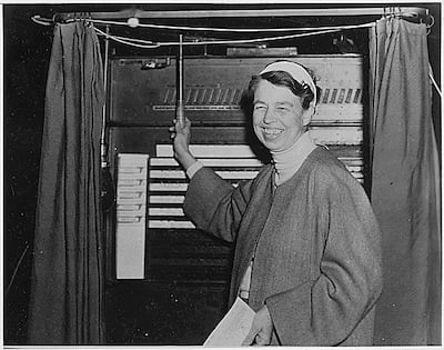 A mechanical lever ballot machine can be seen in the background of this photo of former US first lady Eleanor Roosevelt voting in 1936. Photo: FDR Library / US National Archives