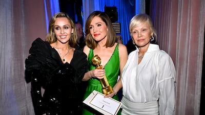 From left, Miley Cyrus, Rose Byrne (Best Actress - Musical or Comedy winner) and Pamela Anderson. Getty