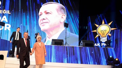 Turkish President Recep Tayyip Erdogan and his wife Emine Erdogan during the unveiling of his Justice and Development Party's election manifesto in Ankara on April 11. AFP