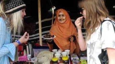 Festival-goers are served dates at the Adach-sponsored UAE tent on the first day of the Womad festival in Wiltshire yesterday.