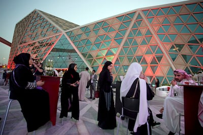 Moviegoers wait to attend a screening, at the King Abdullah Financial District Theater, in Riyadh, Saudi Arabia, April 18, 2018. AP