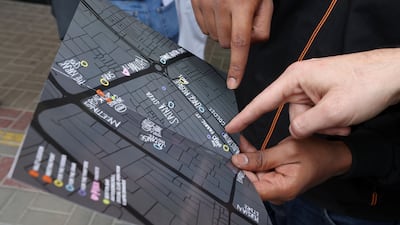 Members of the club use paper maps to find their way around