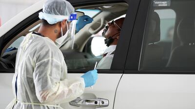 A man taking a PCR test at the centre in Mina Rashed. Pawan Singh / The National