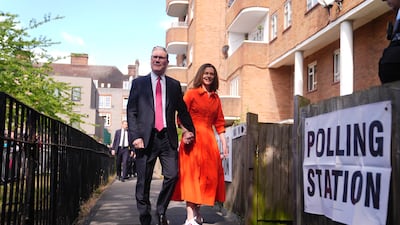 Labour leader Keir Starmer and his wife, Victoria, arrive to cast their votes in Camden, north London. PA
